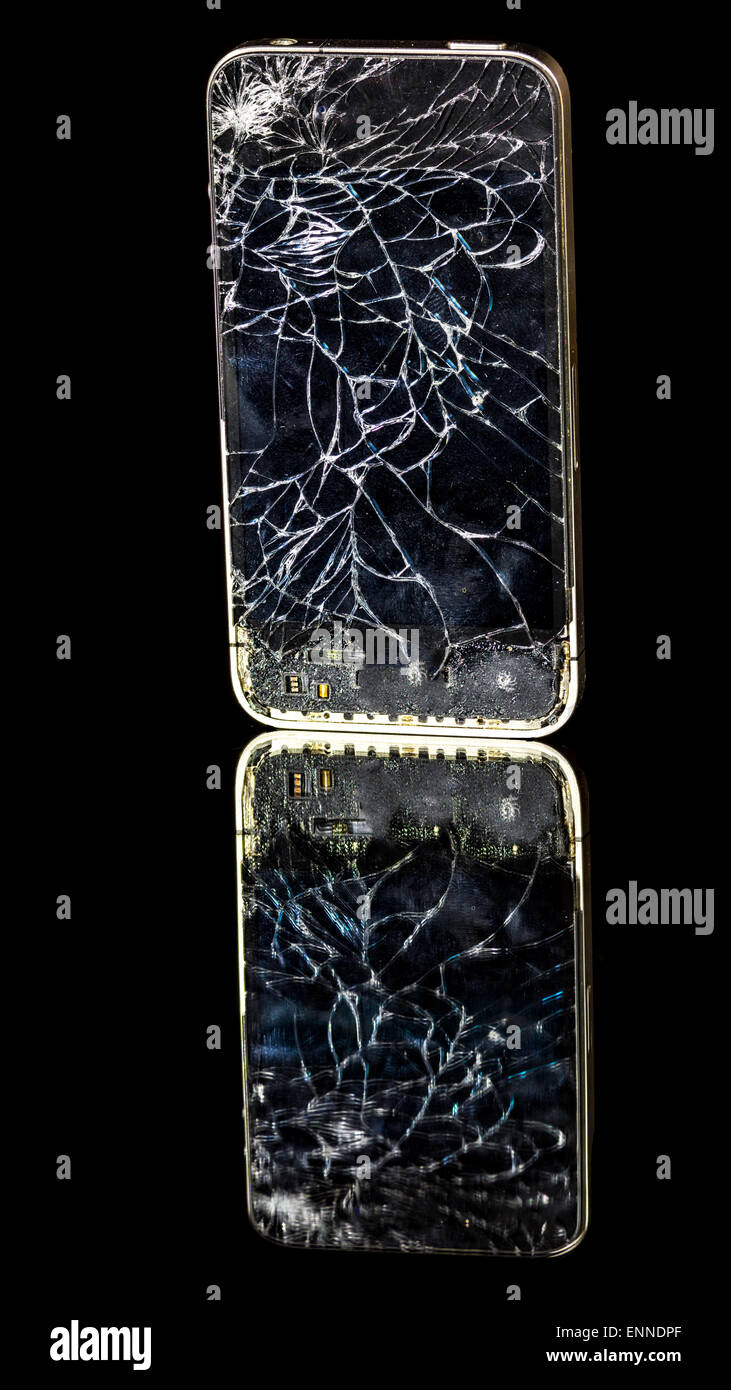 Broken Cell Phone and reflection Stock Photo