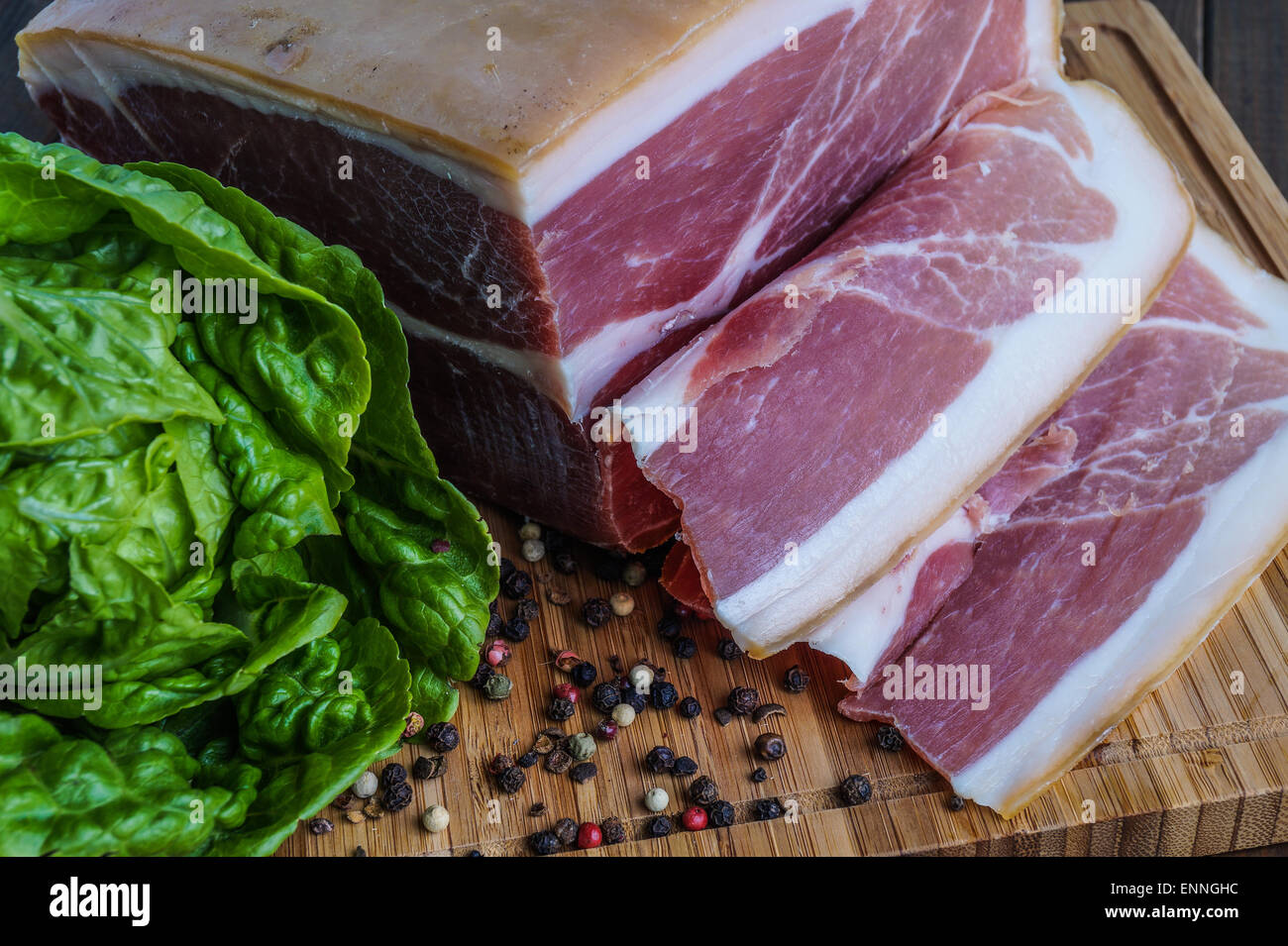 Whole prosciutto italian ham sliced for sandwich Stock Photo Alamy