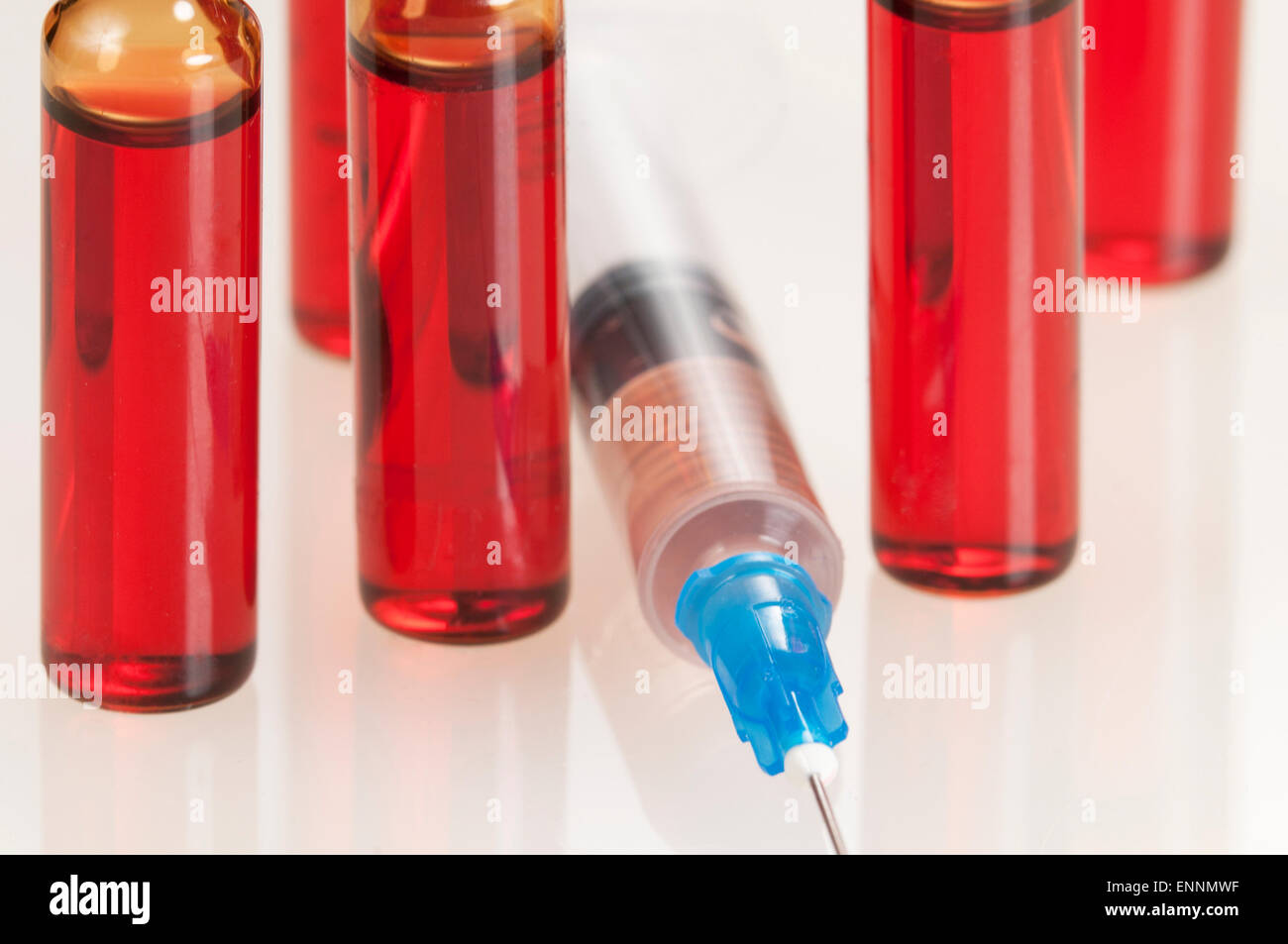 Syringe and ampules, close-up shot, local focus Stock Photo