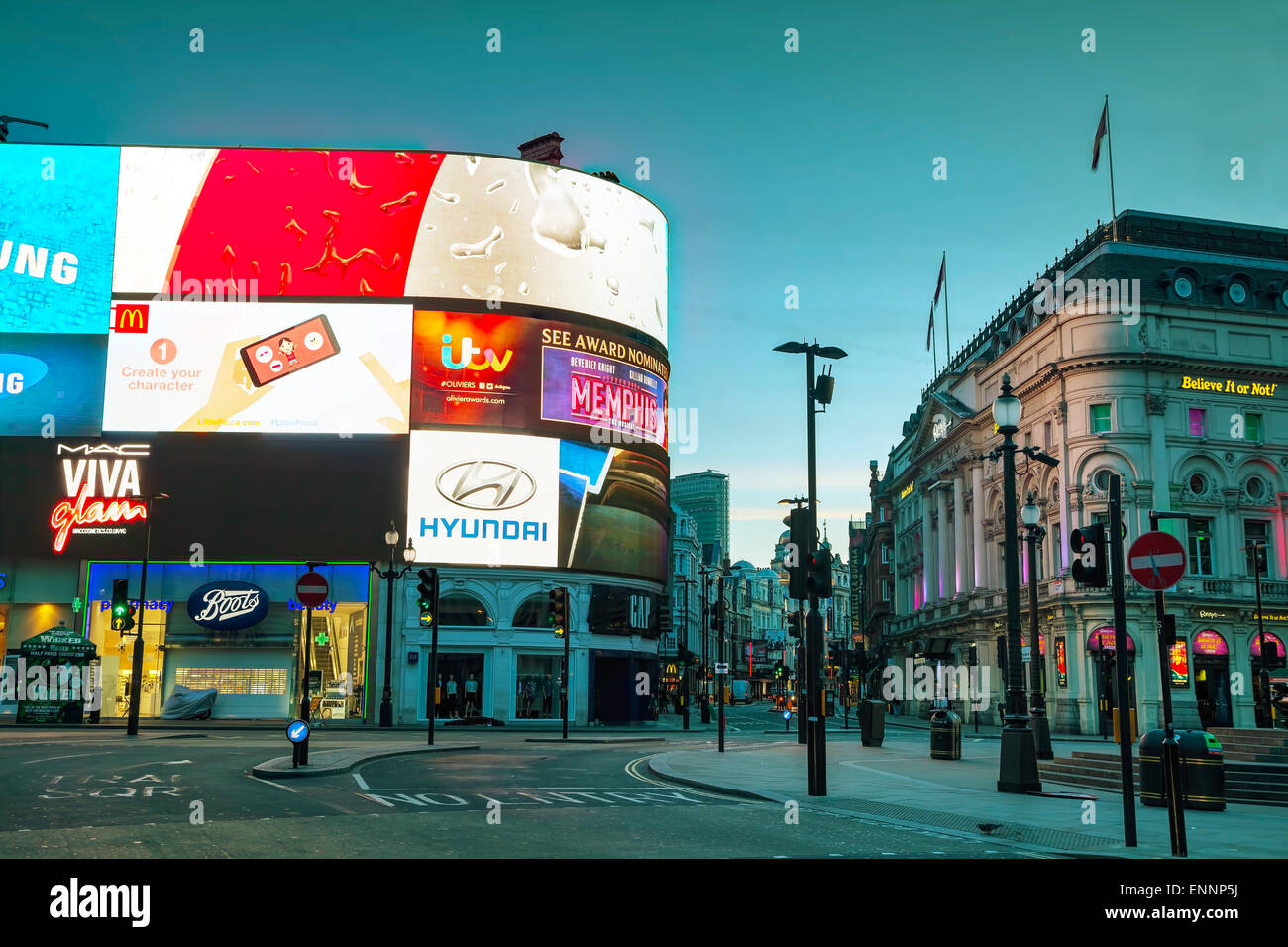 LONDON - APRIL 12: Piccadilly Circus junction early in the morning on April 12, 2015 in London, UK. Stock Photo