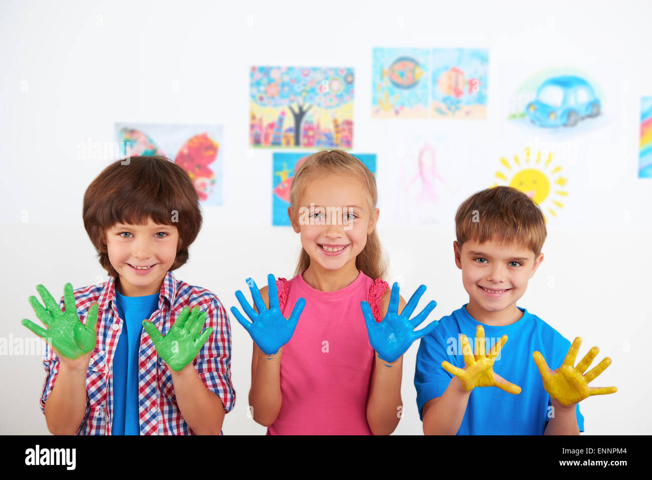 Happy children showing painted hands Stock Photo - Alamy