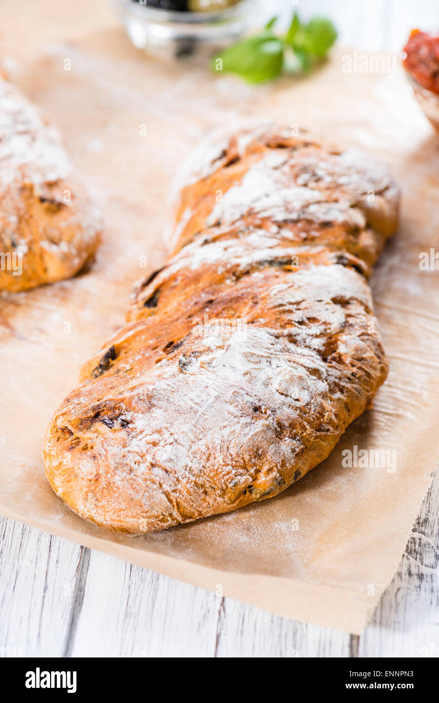 Ciabatta bread with sundried Tomatoes, Basil and Olives (closeup shot