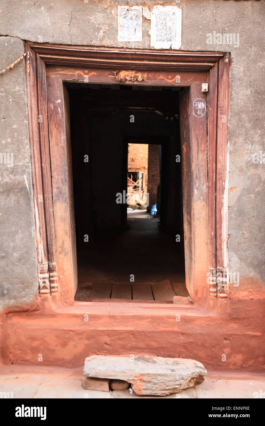 Typical low wooden doorway at entrance to old Newari house in Bhaktapur, Nepal Stock Photo