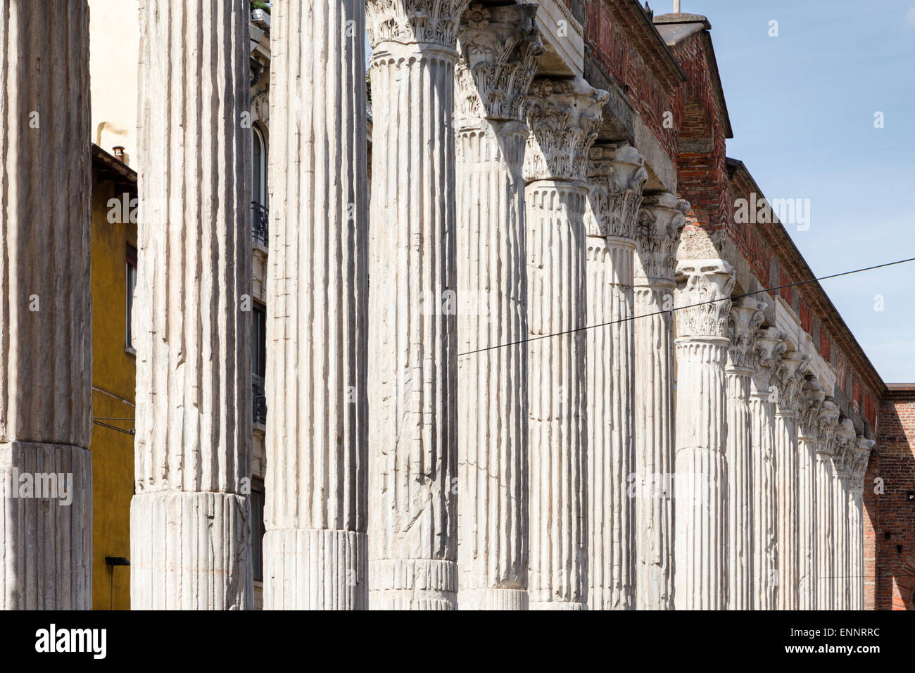 Colonnade of ancient Roman Corinthian columns in front of the church of San Lorenzo, Milan. Stock Photo