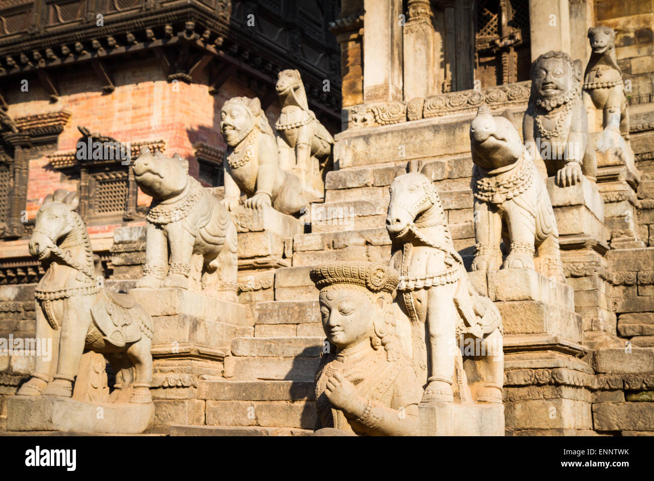 Statues lining steps of historic Hindu temple in Bhaktapur, Nepal Stock Photo