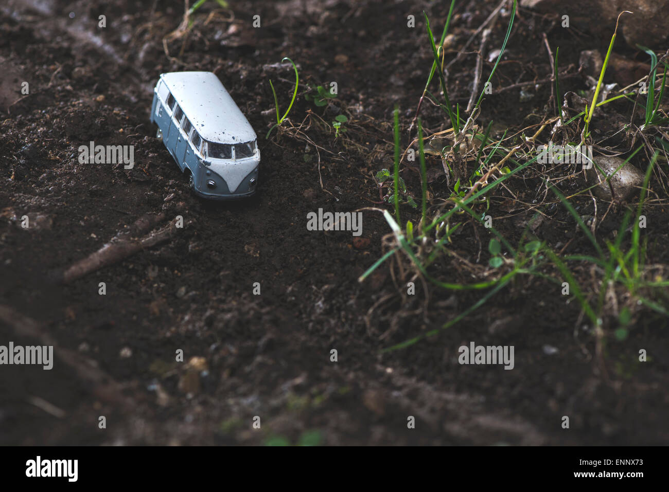 Vintage bus VW. Small metal toy in the nature. Miniature Stock Photo