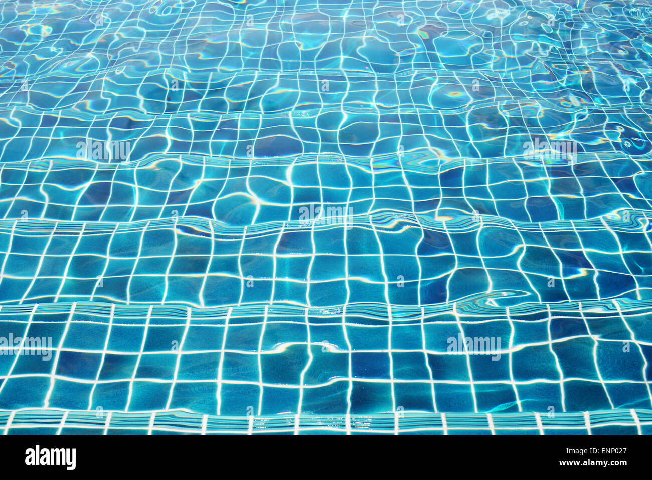 Blue ceramic wall tiles and details of surface on swimming pool background Stock Photo