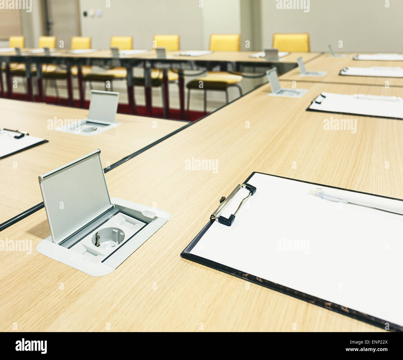 Interior of a modern conference room, tables with built in power supply
