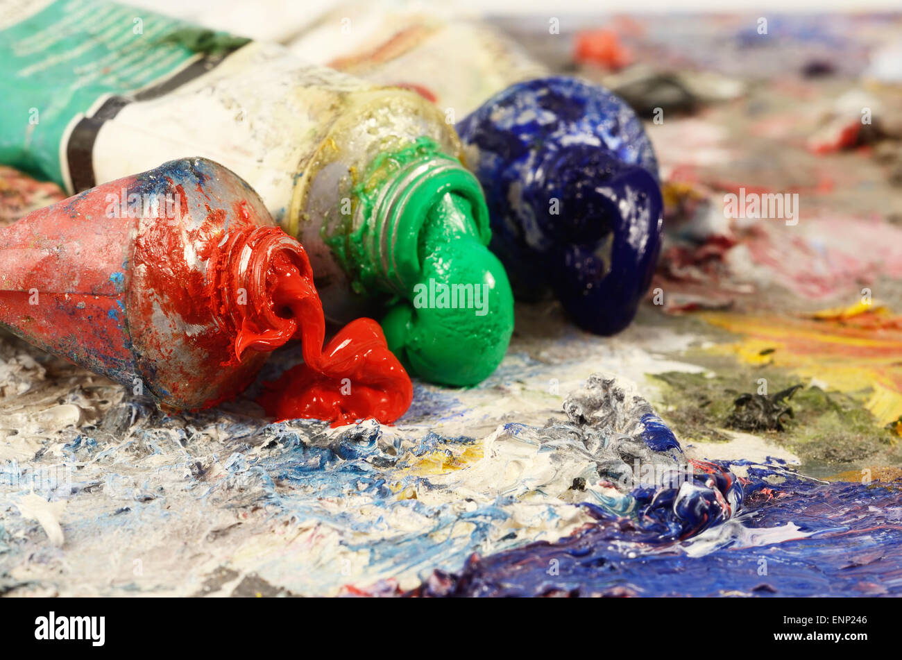 Art still life  - closeup of three oil paint tubes with red,green and blue colours ,background for creative art design Stock Photo