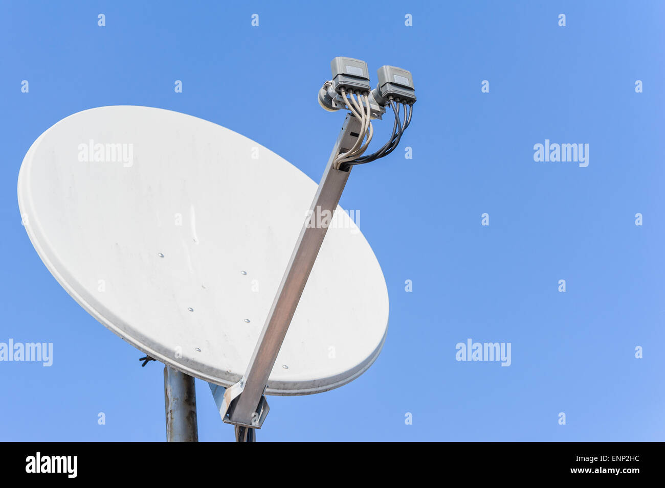 Satellite dish the background of a blue sky Stock Photo