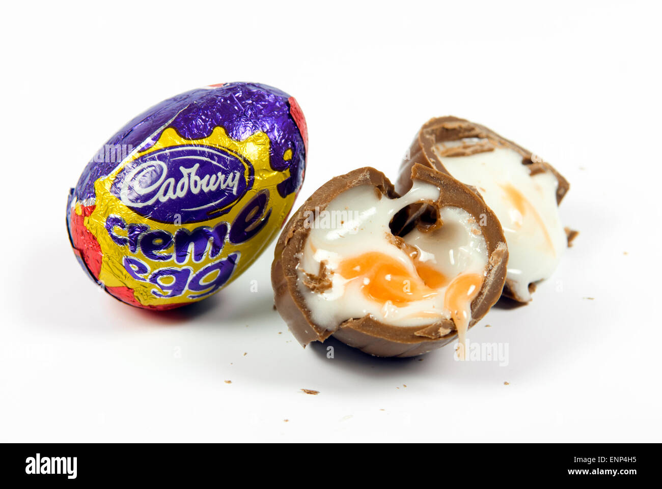 Cadbury Creme eggs oozing out onto a white background Stock Photo