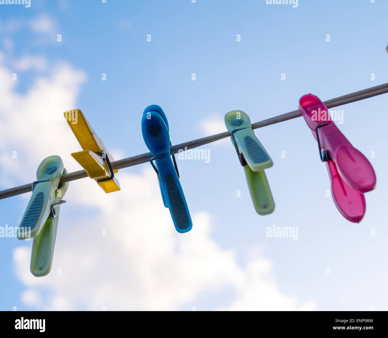 Plastic Clothes Pegs on Washing Line Stock Photo