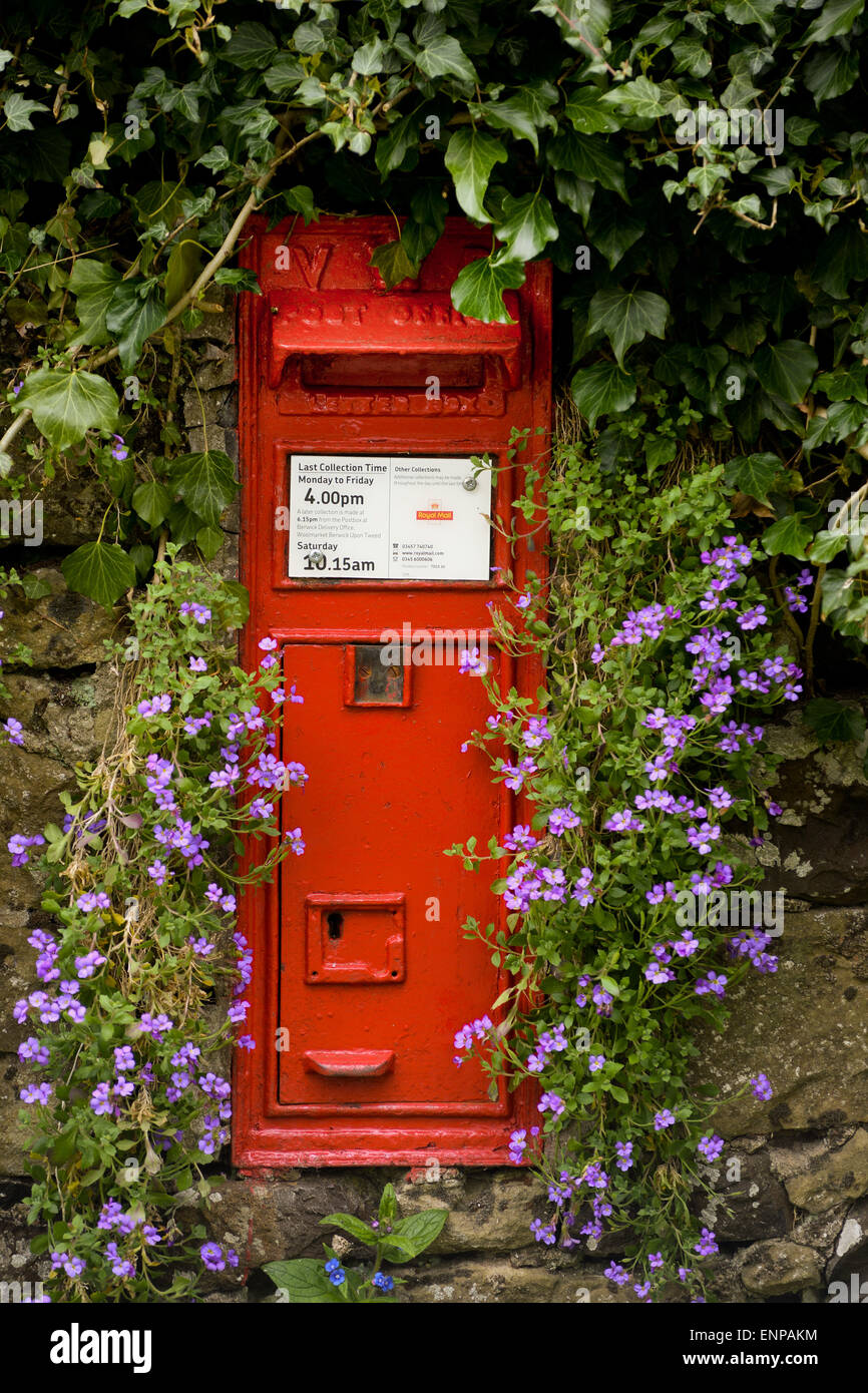 Victorian wall mounted post box in the small Scottish hamlet of Horndean in the Scottish Borders. Stock Photo