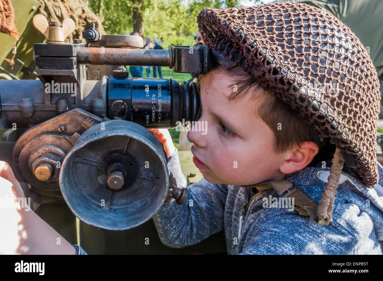 London, UK. 09th May, 2015. A Russian boy has a go at aiming a 17 pounder anti-tank gun in St James Park. VE Day 70 commemorations - Three days of events in London and across the UK marking historic anniversary of end of the Second World War in Europe. Credit:  Guy Bell/Alamy Live News Stock Photo