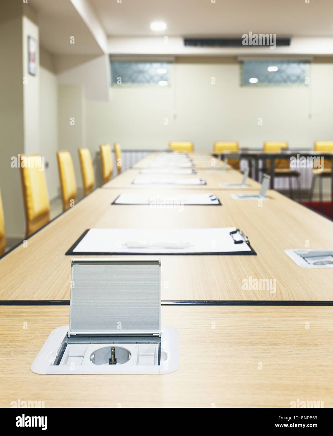 Interior of a modern conference room, tables with built in power supply
