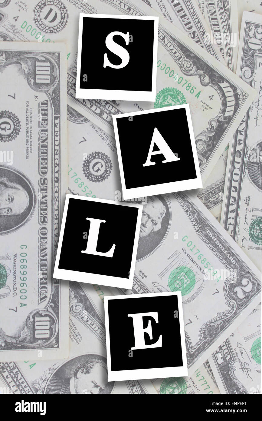 inscription sale on the American dollars background Stock Photo