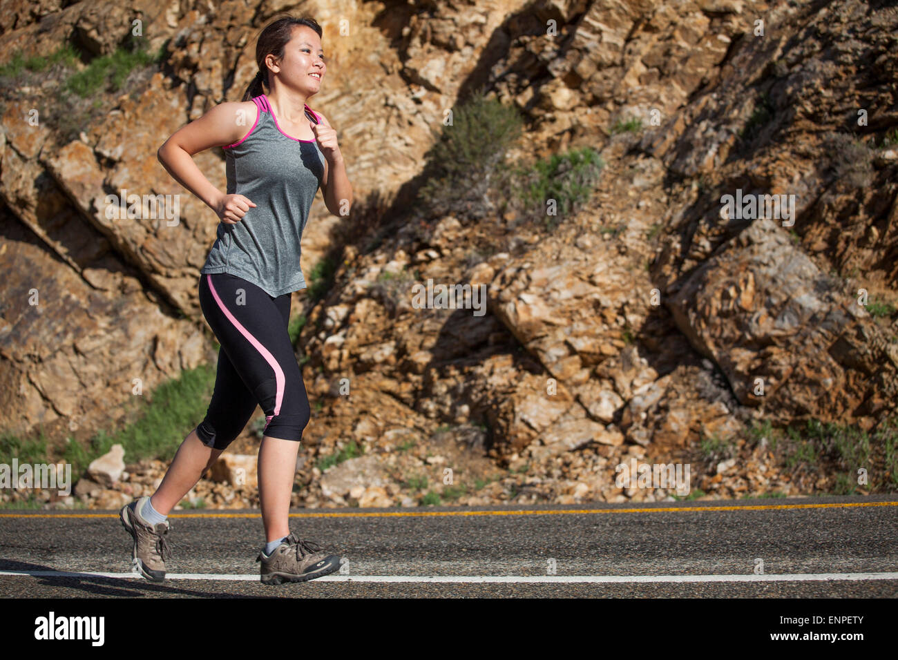 Woman running outdoors brunette trail running woman, female, run, running, cross-training, fitness, exercise, fitness, exercises Stock Photo