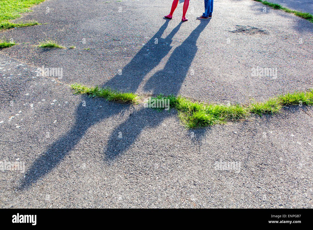 Shadows of people on asphalt Stock Photo