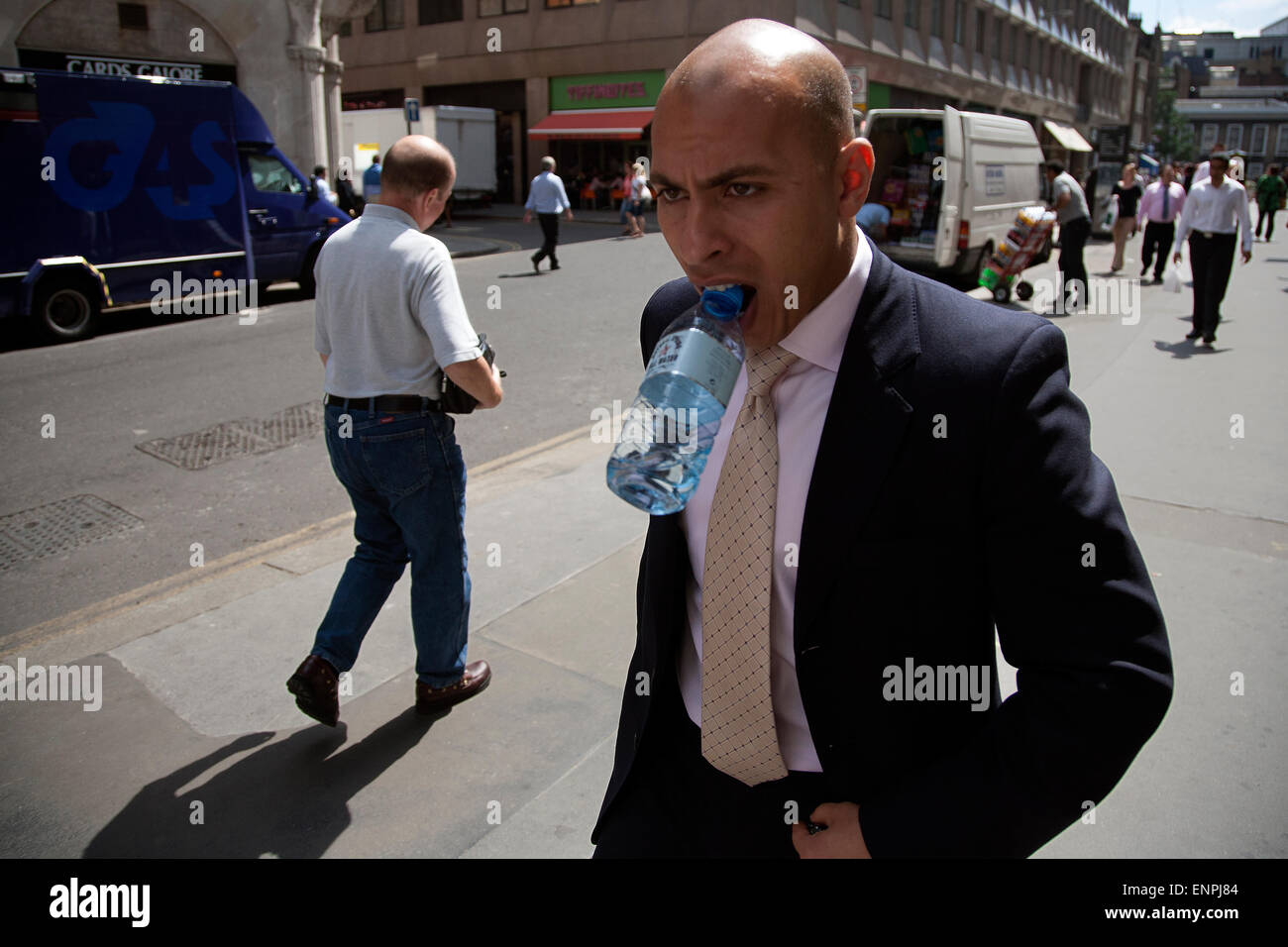 city of london man drinks water Stock Photo