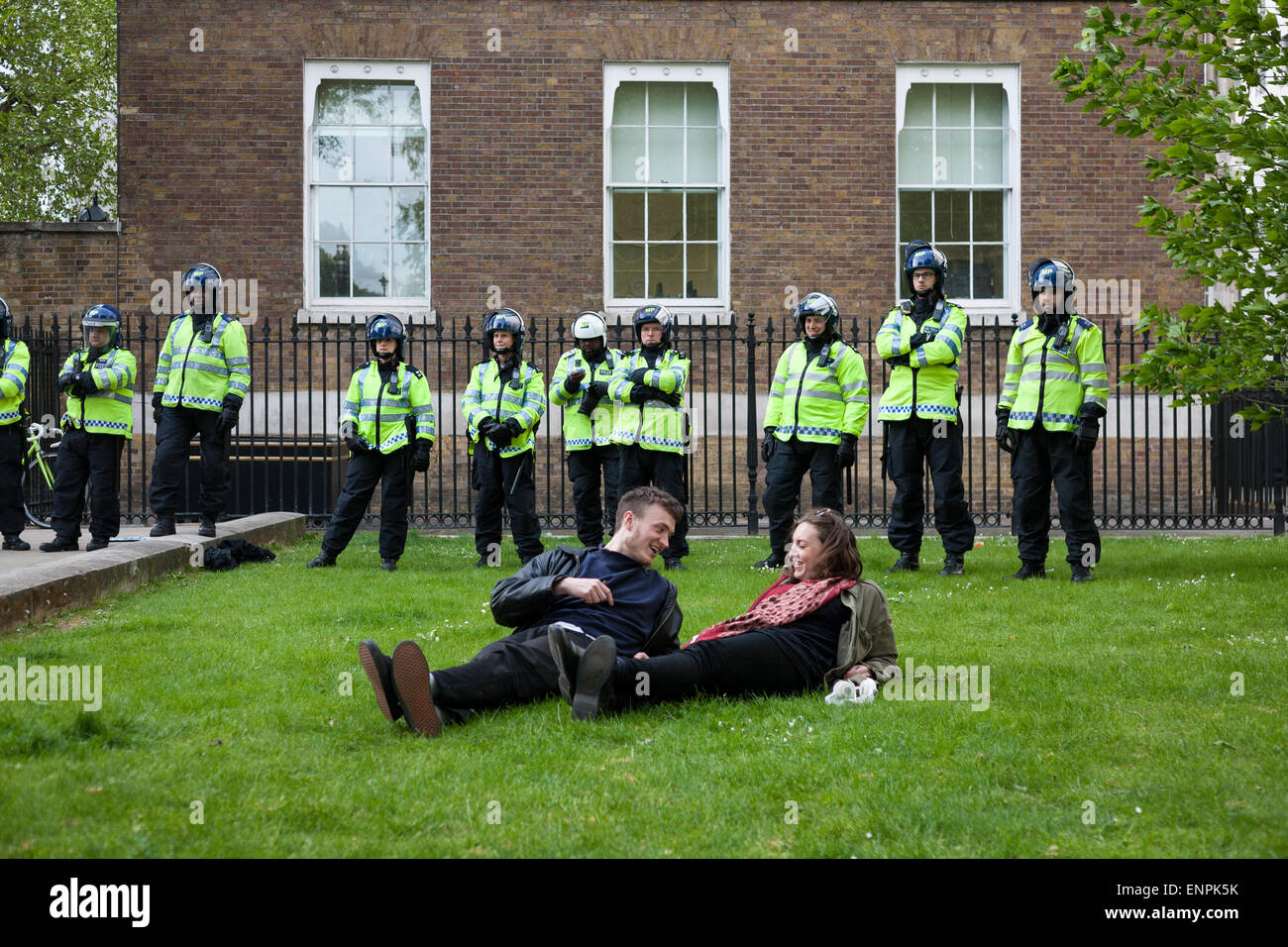 London, UK. 9th May, 2015. Demonstrators on Whitehall relax during an anti-Tory protest in central London two days after the UK general election gave David Cameron's Conservative Party - the Tories - a parliamentary majority. The centre-right Conservative Party are now set to govern the UK for the next five years without the need to form a coalition with any other party. Credit:  David Cliff/Alamy Live News Stock Photo
