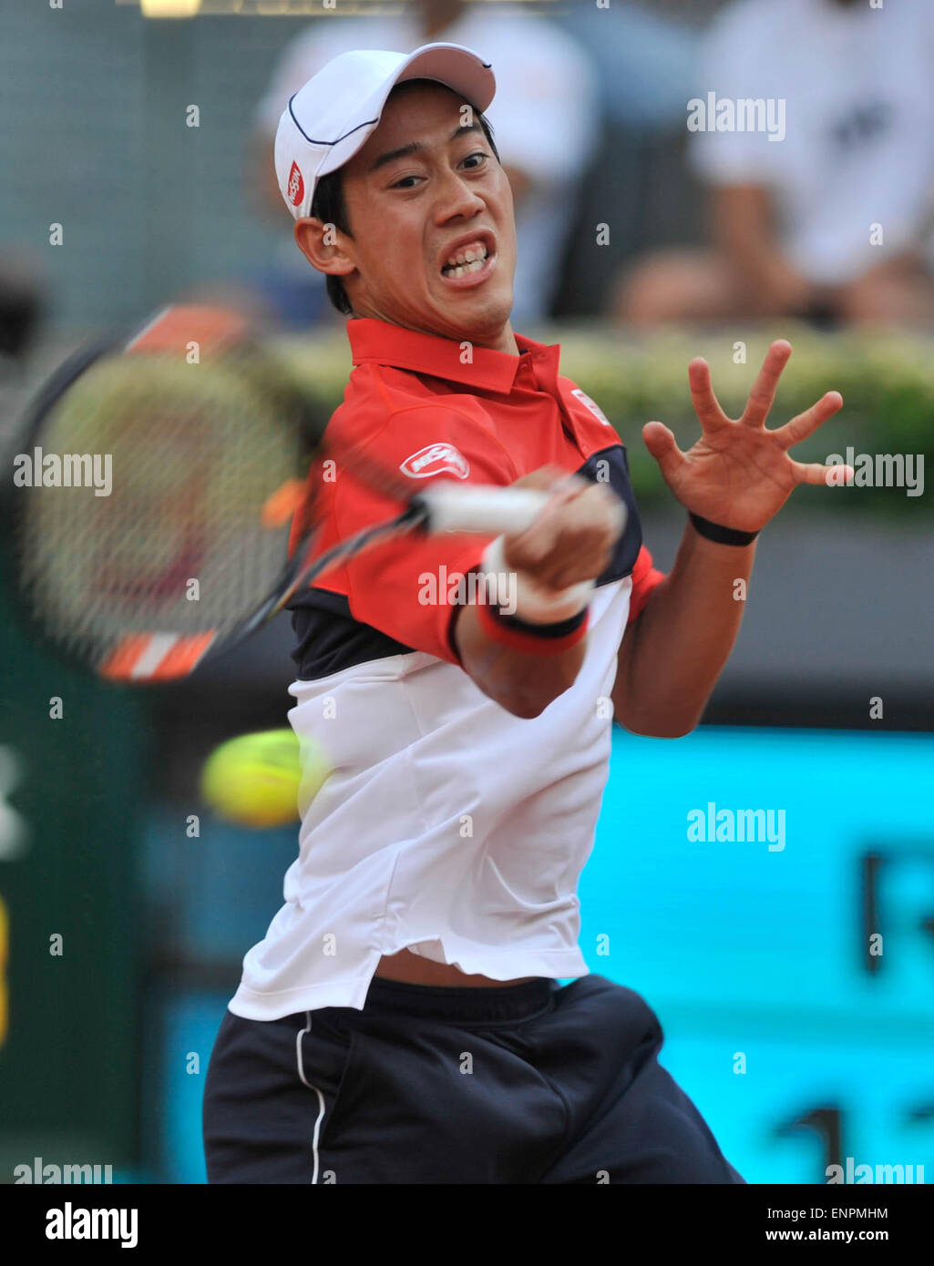 Madrid, Spain. 9th May, 2015. Kei Nishikori of Japan hits a return during a men's singles semifinal match against Andy Murray of Britain at the Madrid Open tennis tournament in Madrid, Spain, May 9, 2015. Kei Nishikori lost 0-2. Credit:  Xie Haining/Xinhua/Alamy Live News Stock Photo