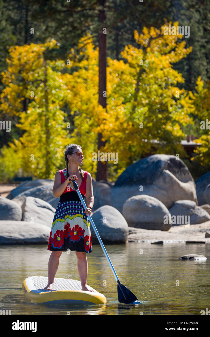 Fall stand up paddle boarding near Sand Harbor on Lake Tahoe Stock