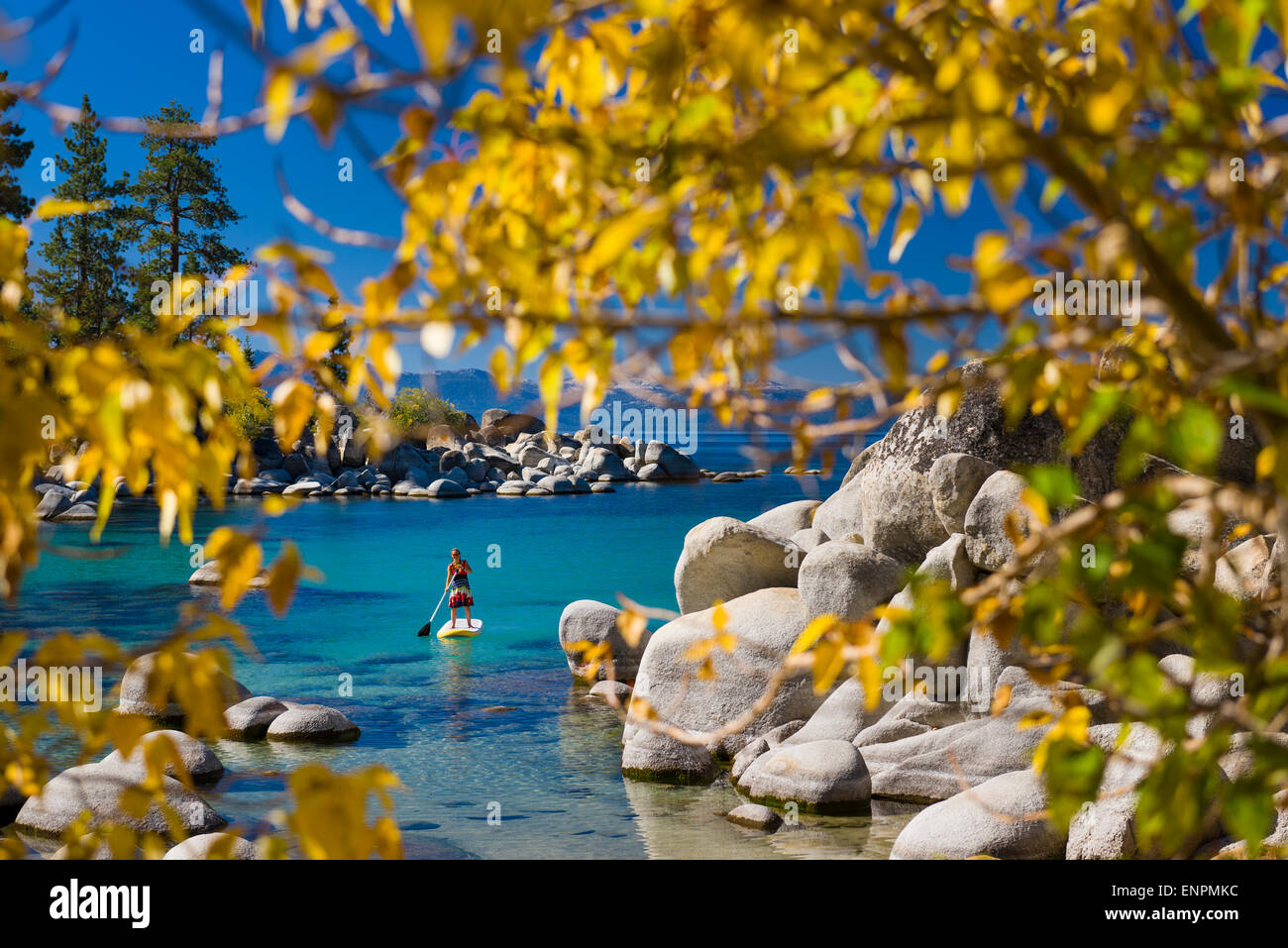 Fall stand up paddle boarding near Sand Harbor on Lake Tahoe Stock
