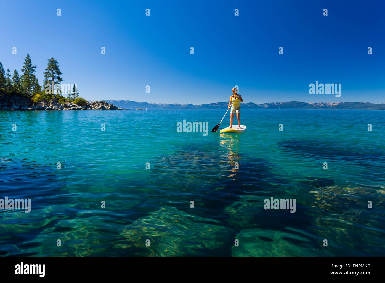 Stand up Paddle Boarding near Sand Harbor on Lake Tahoe Stock Photo