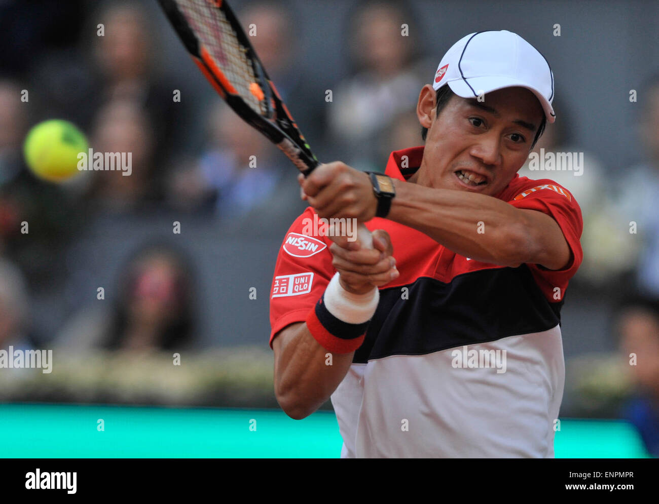 Madrid, Spain. 9th May, 2015. Kei Nishikori of Japan hits a return during a men's singles semifinal match against Andy Murray of Britain at the Madrid Open tennis tournament in Madrid, Spain, May 9, 2015. Kei Nishikori lost 0-2. Credit:  Xie Haining/Xinhua/Alamy Live News Stock Photo