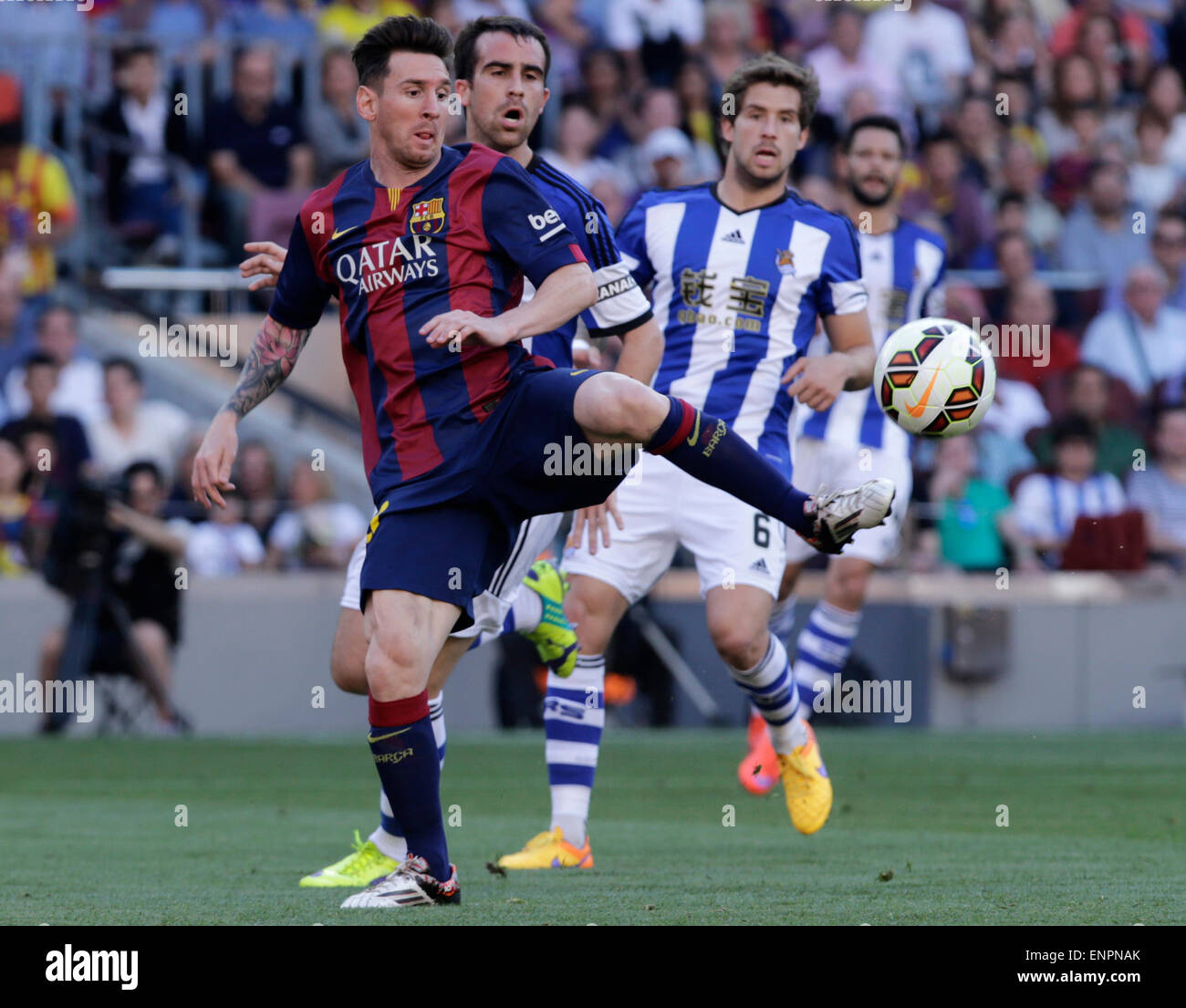 Barcelona, Spain. 9th May, 2015. FC Barcelona's Lionel Messi (L) competes during the La Liga soccer match against Real Sociedad at Camp Nou Stadium in Barcelona, Spain, May 9, 2015. FC Barcelona won 2-0. Credit:  Pau Barrena/Xinhua/Alamy Live News Stock Photo
