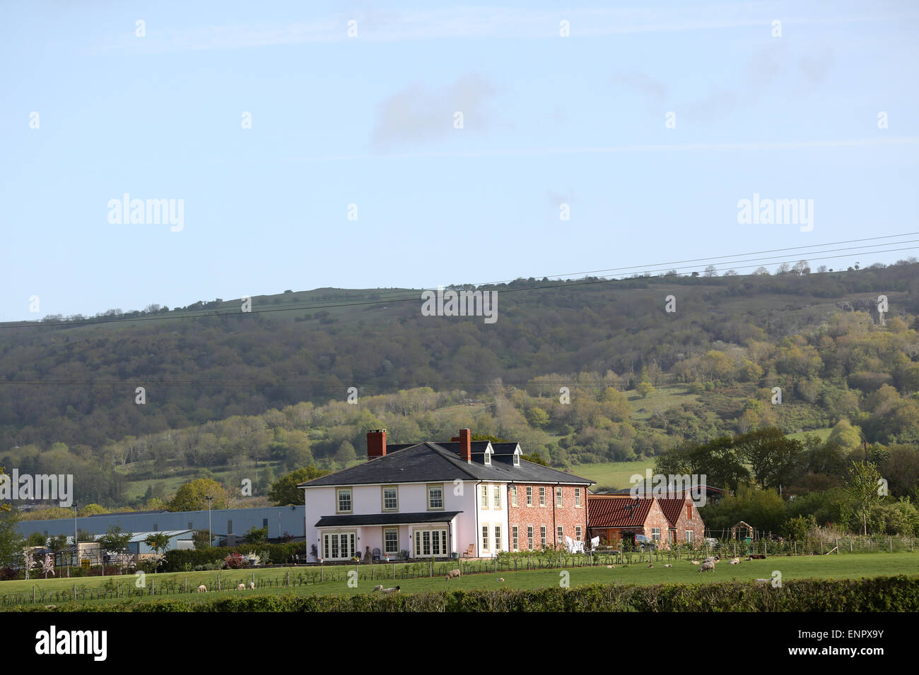 Large house in the Somerset, with the Mendip hills behind. Stock Photo
