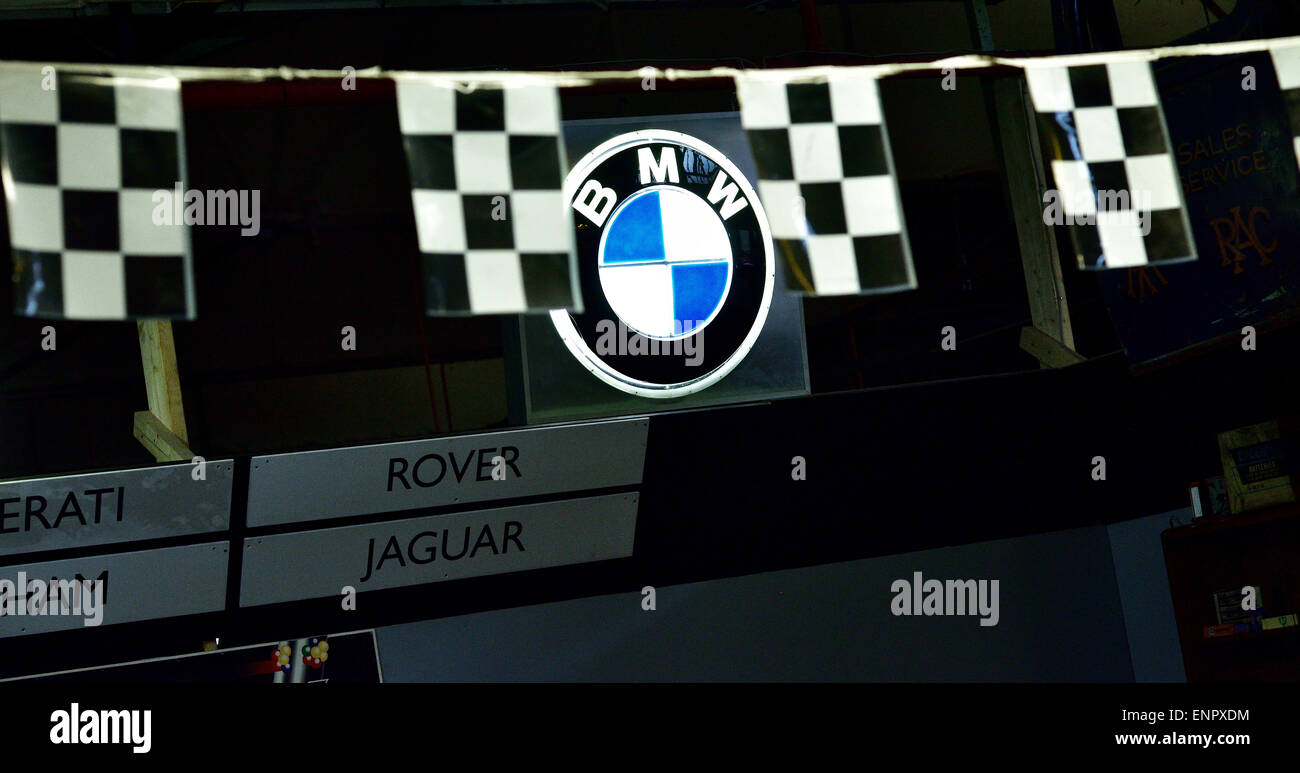 Racing flag bunting around the badge of a BMW Stock Photo