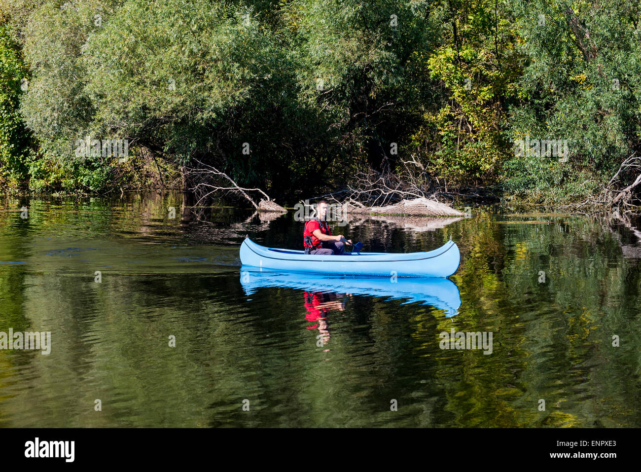 Young man in canoe Stock Photo - Alamy