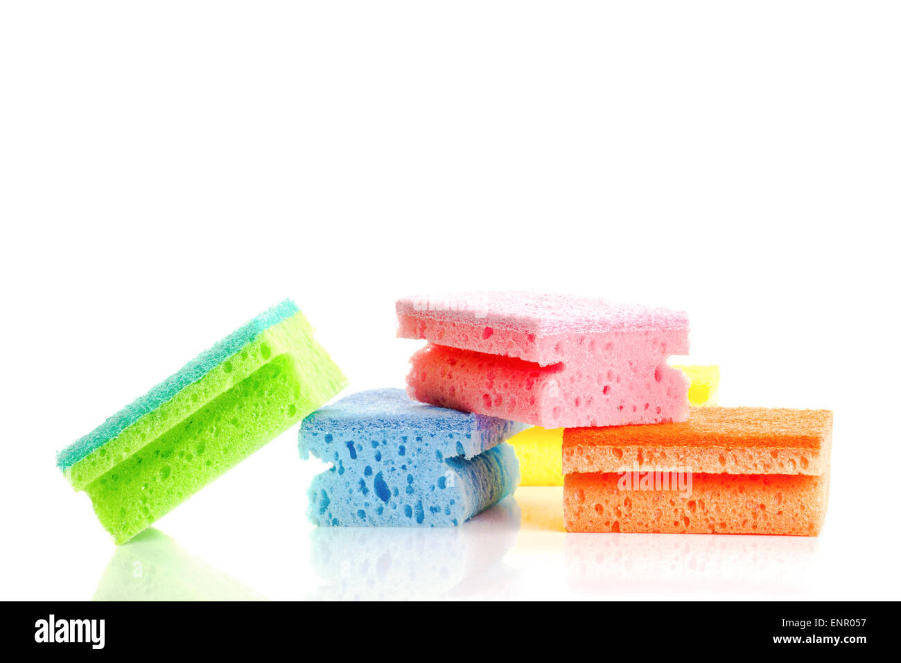 Stack of Colorful Cleaning Sponges on White Background with Reflection