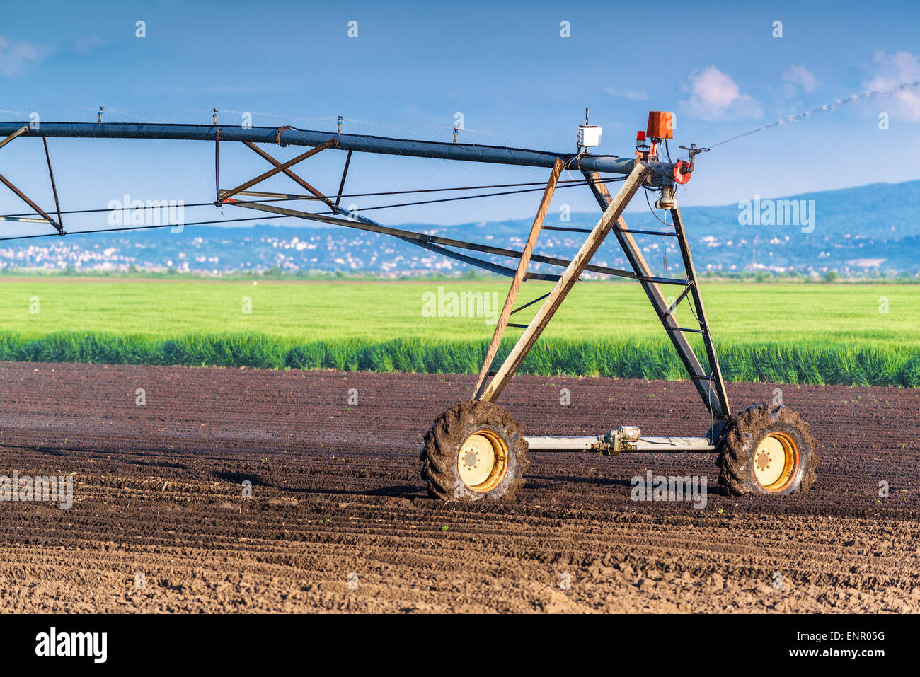 Automated Farming Irrigation Sprinklers System in Operation on ...