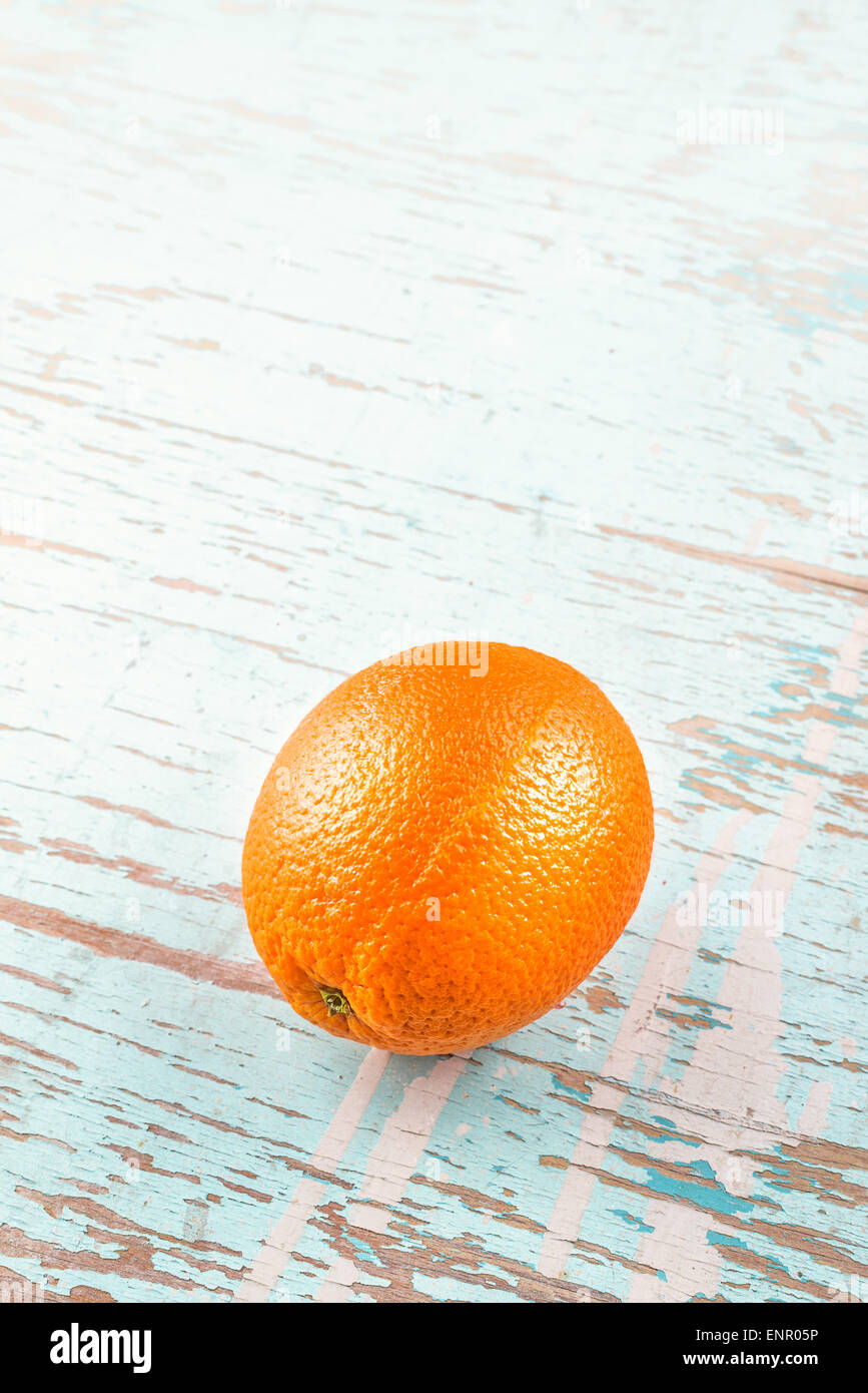 Fresh Ripe Sweet Orange Fruit on Rustic Grunge Blue Wood Background Stock Photo