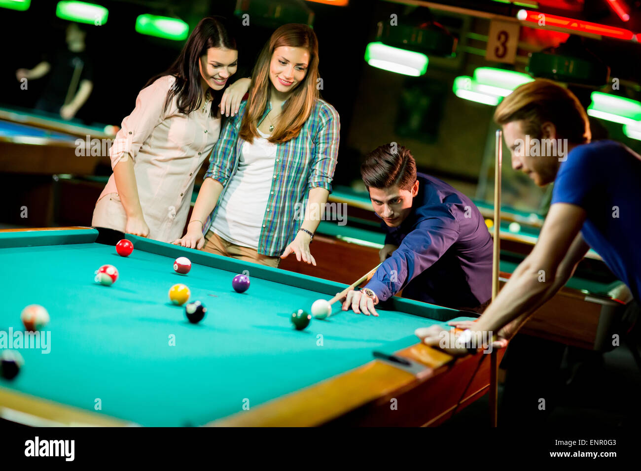 Young people playing pool Stock Photo Alamy