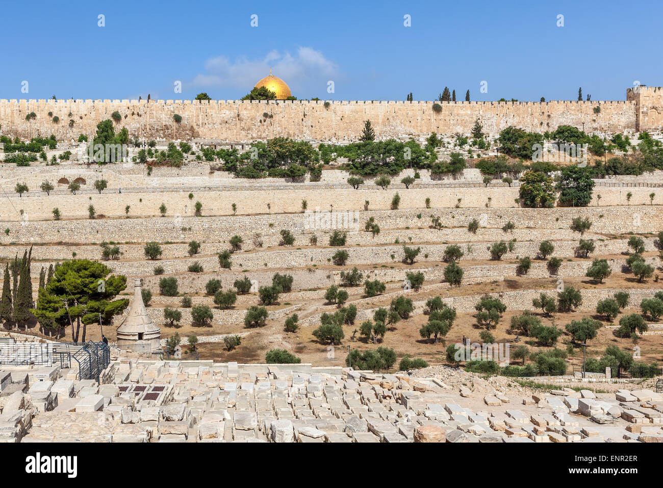 Old Jewish cemetery as ancient walls and Dome of the Rock mosque on background in Jerusalem, Israel. Stock Photo