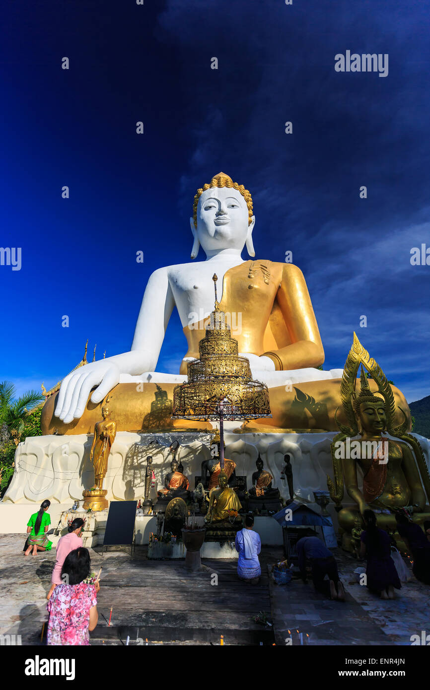 Sitting Buddha Statue with prayers in Wat Phra That Doi Kham Temple ...