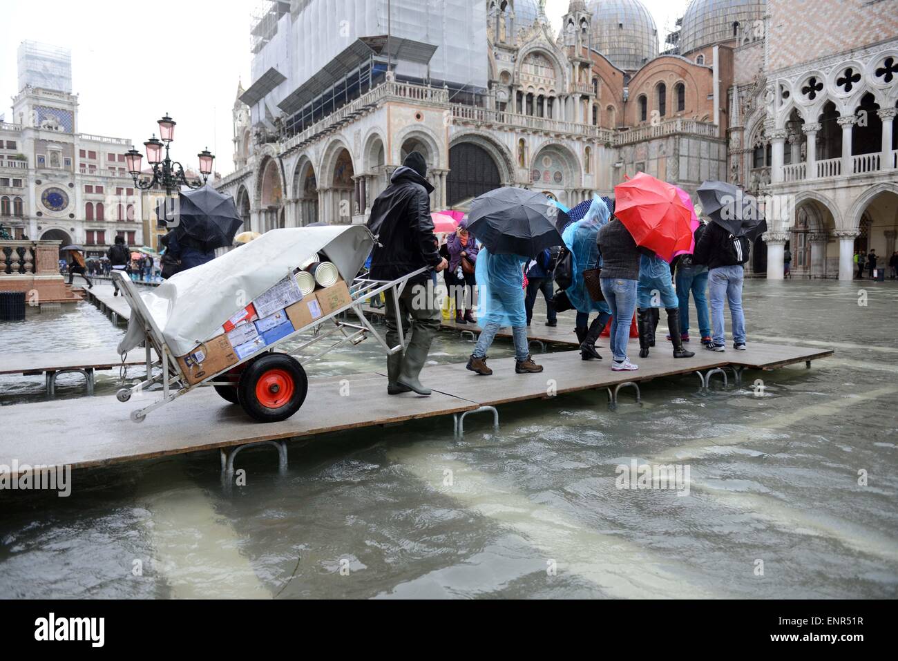 Venice is experiencing 'Acqua alta'(high water) measured at 115 cm. Acqua alta is a phenomenon which generally takes place in Venice in the winter time. When a combination of astronomical tide, strong winds and seiche (the periodic movement of sea waters, Stock Photo