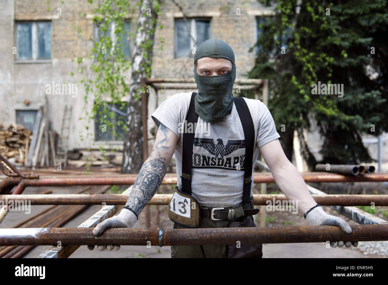April 25, 2015 - Kiev, Ukraine - An Azov volunteer in their training camp in Kiev. He is wearing a Consdaple shirt, a clothing brand for and by right wing extremists. You can see the letters ''NSDAP'' (Hitler's Nazi party).The Azov battalion was named after the blue waters of this southeastern Ukrainian sea. More than half of the battalionâ€™s fighters are Russian-speaking eastern Ukrainians. Many of the Azov Battalion members are, by their own description, ultra-right Ukrainian nationalists.The Azov training camp is located in a very large area, formerly an ex agricultural machinery factory.  Stock Photo