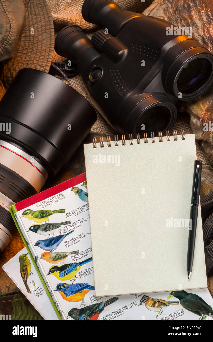 Birdwatching - Binoculars, camera, bird books and a notebook and pen - Space for text Stock Photo