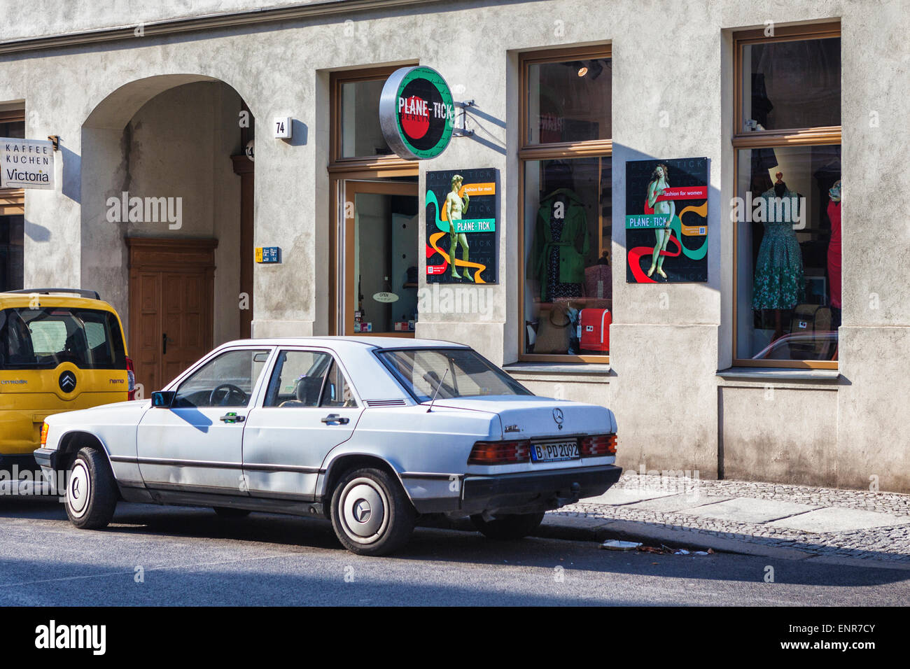 Plane-Tick Trendy fashion shop for men and women exterior and old dented Mercedes  Benz car, Mitte Berlin Stock Photo - Alamy