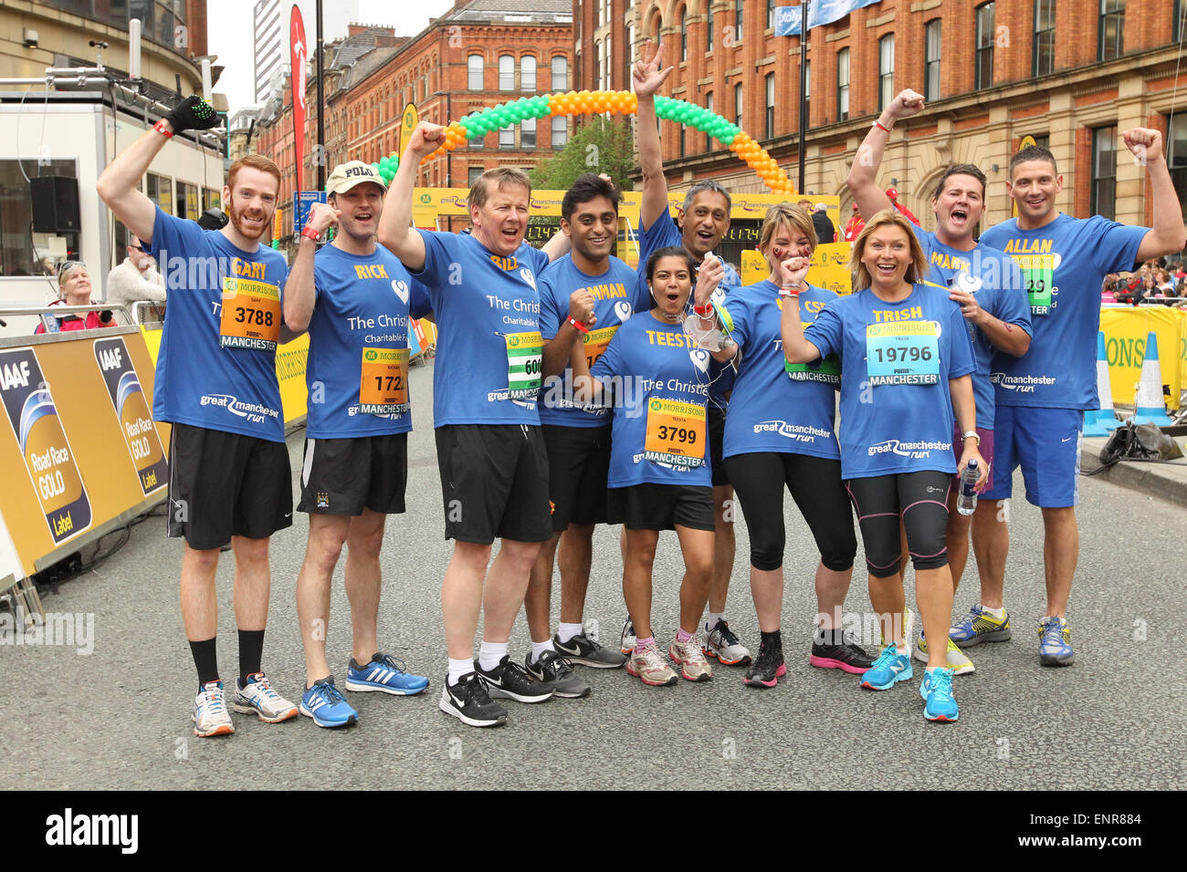 Manchester, UK. Sunday 10 May 2015. The city hosted the Morrison's Great Manchester Run in the heart of the city centre. The Christie Team including BBC presenter Bill Turnbull (3rd left) and actress Tricia Penrose (3rd right). Credit:  Michael Buddle/Alamy Live News Stock Photo