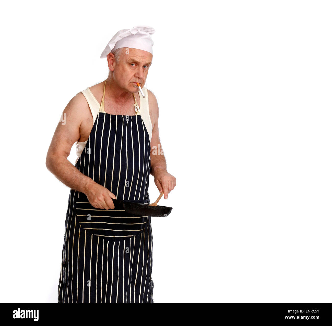 Man as a low grade chef or cook in a greasy spoon Cafe, smoking while he cooks. Stock Photo