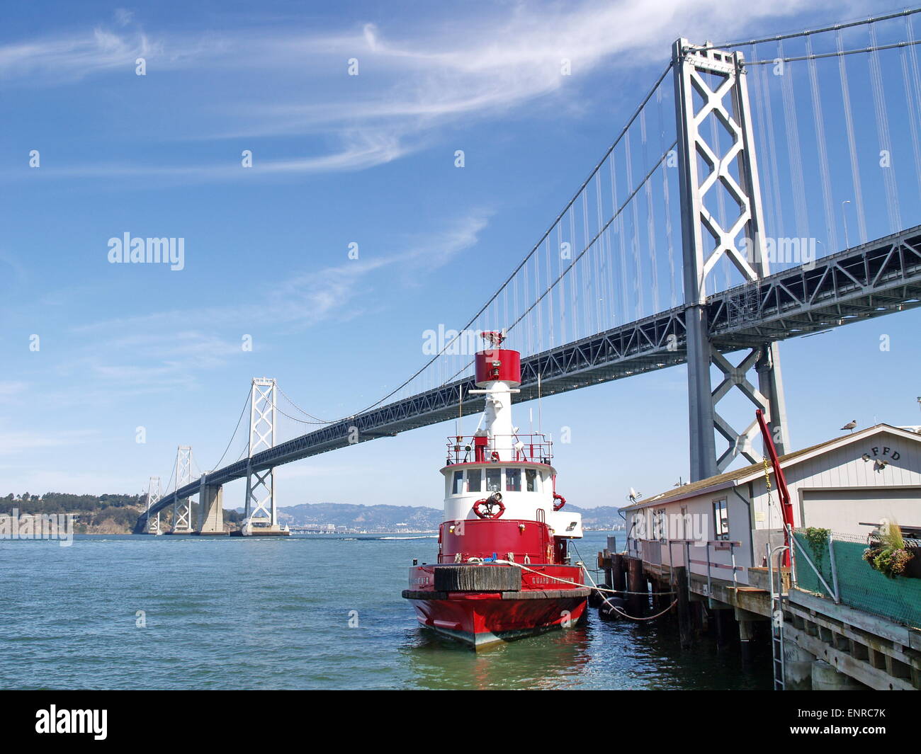 San Francisco Bay Bridge with a red ship Stock Photo - Alamy