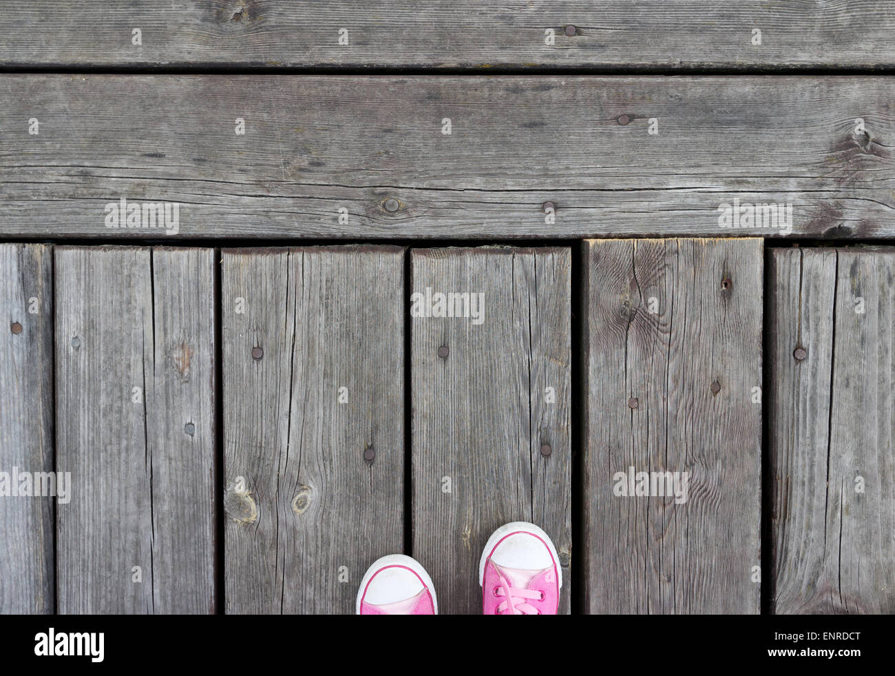 Pink shoes on a old wooden footbridge Stock Photo - Alamy