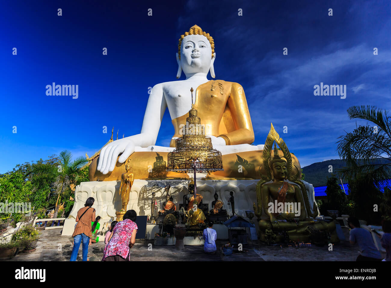Sitting Buddha Statue with prayers in Wat Phra That Doi Kham Temple ...