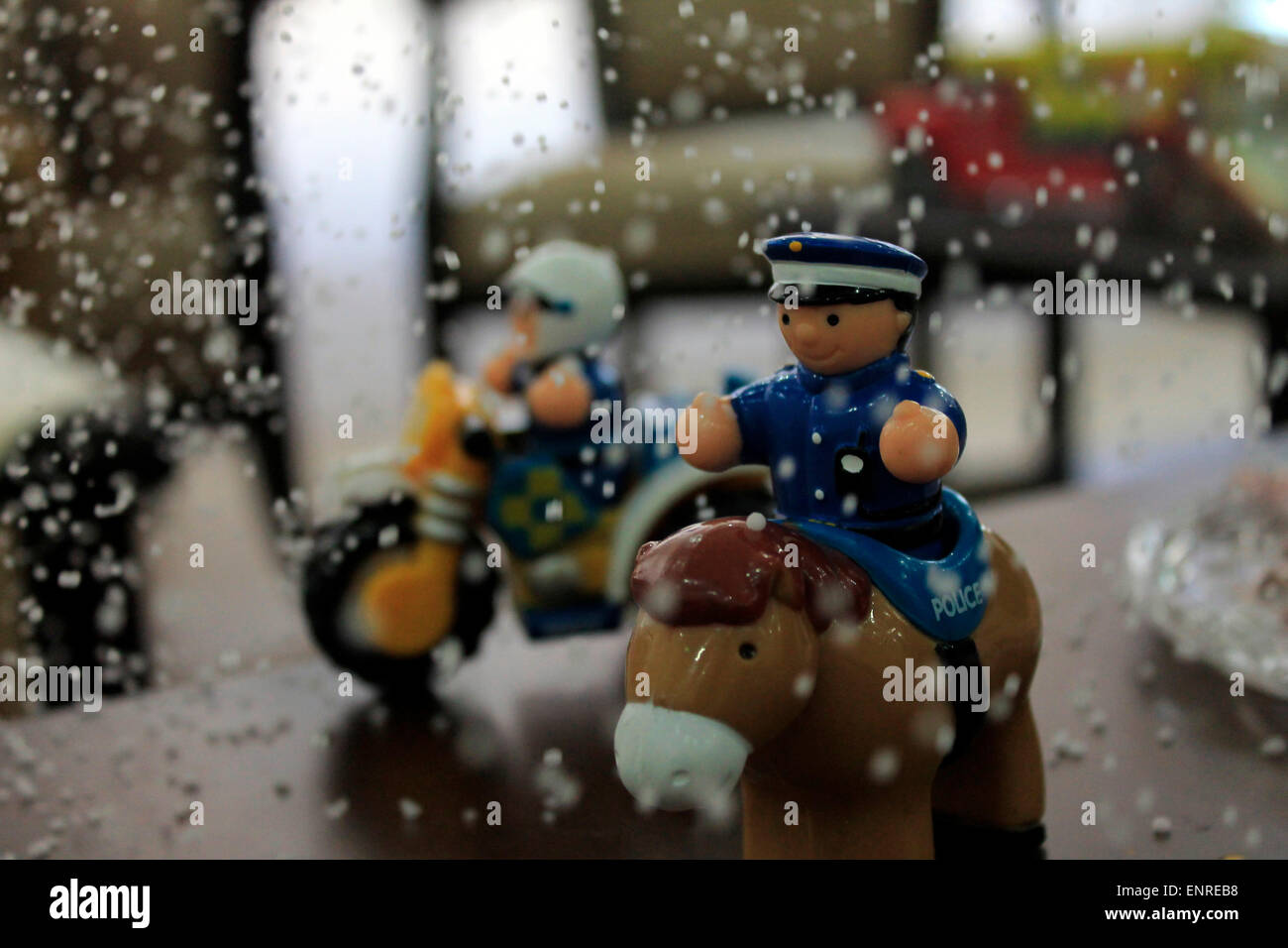 police toys - horse and bike  riding Stock Photo