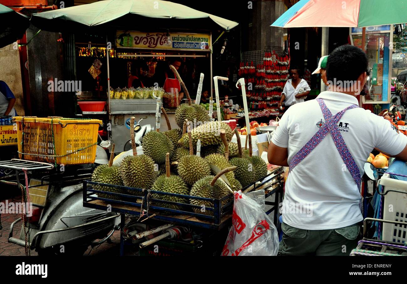 Bangkok, Thailand  Vendor selling tropical Durian fruits from a push cart on Yaowarat Road in Chinatown Stock Photo